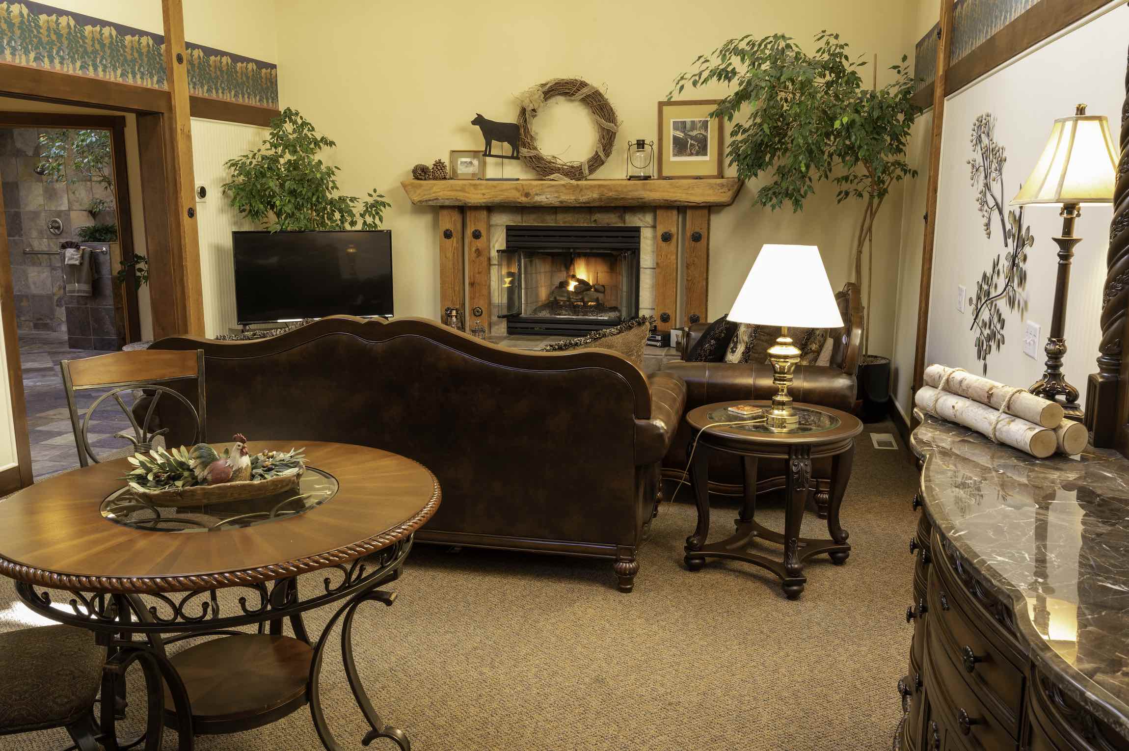  A fireplace warms the living room of the Pine Ridge Suite at Country Willows Inn & Estate in Ashland, Oregon. The Pine Ridge Suite has a jacuzzi hot tub. 