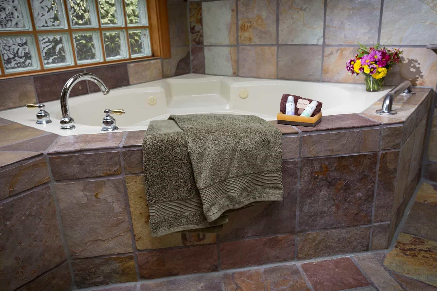  Relax in a 2-person jacuzzi hot tub in the Pine Ridge Suite at Country Willows Inn & Estate in Ashland, Oregon. 